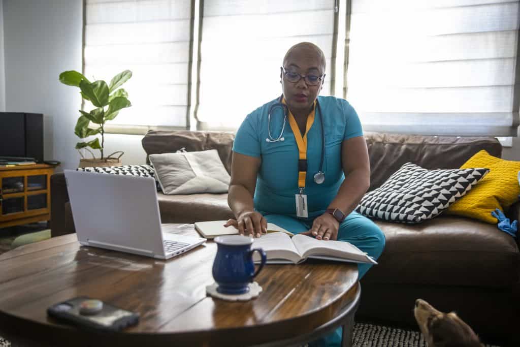 Black Female Nurse Studying Between Shifts