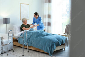 Portrait of radiologist smiling while colleague preparing patient for xray in examination room