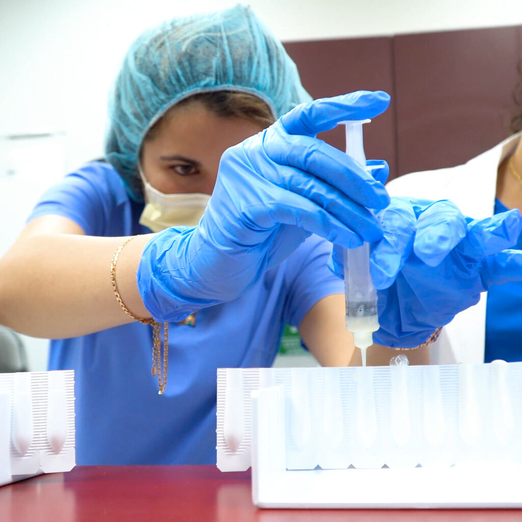 A pharmacy tech students measures carefully