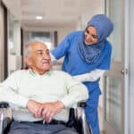 florida registered nurse taking care of a senior patient in a wheelchair