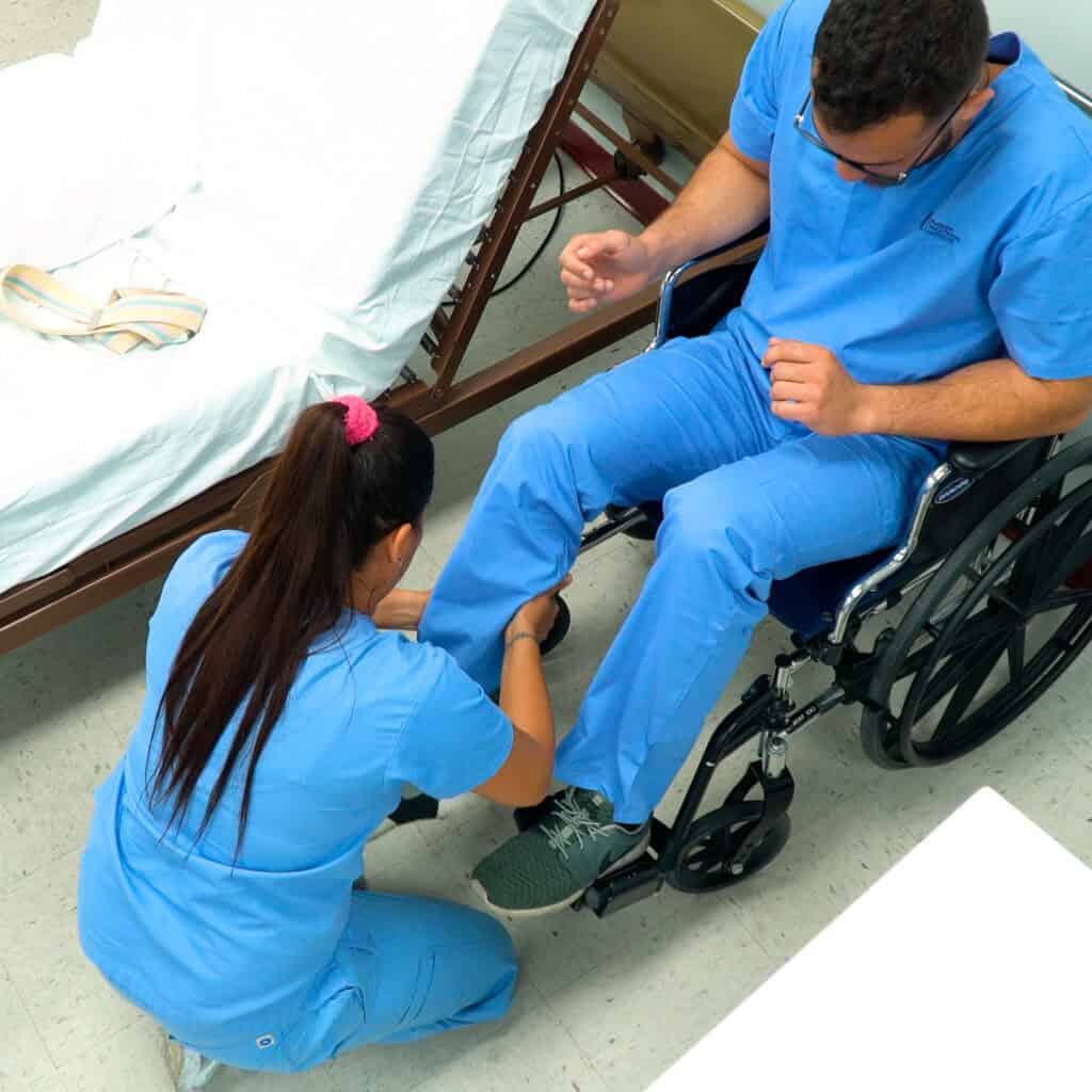 patient care tech students practicing their skills