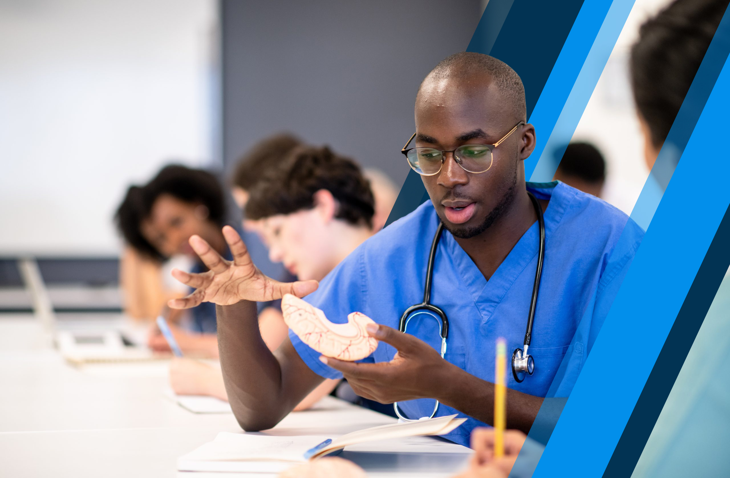 Student explains concepts to another student in medical classroom