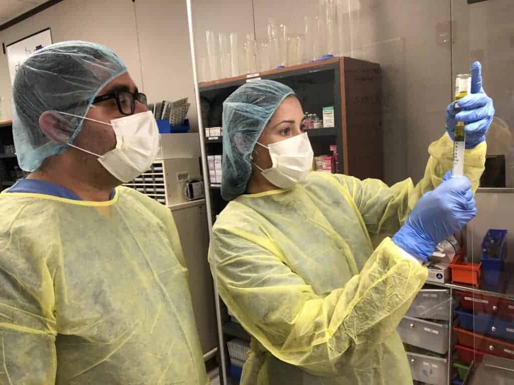 pharmacy tech student working with a syringe