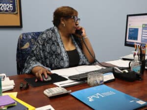 Admissions coordinator on the phone