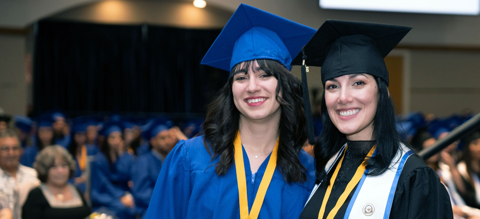 Two FVI graduates at a ceremony